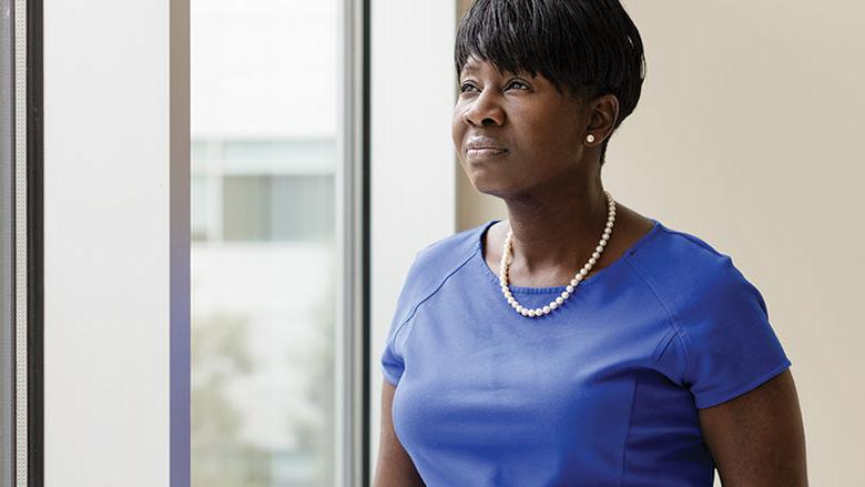 Dr. Kesha Morant Williams stands by a window at the Penn State Health St. Joseph location