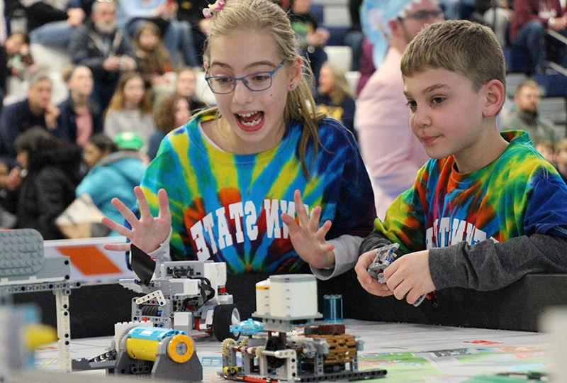FIRST LEGO Smart Software team memebers Smart Software team members Ryan Avram and Caylyn Hauser present their robot during the tournament.