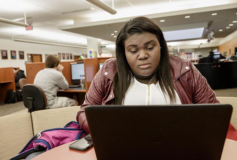 A student works in the Thun Library