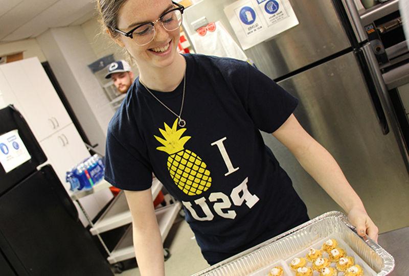 Student preparing food at Opportunity House Student preparing food at Opportunity House