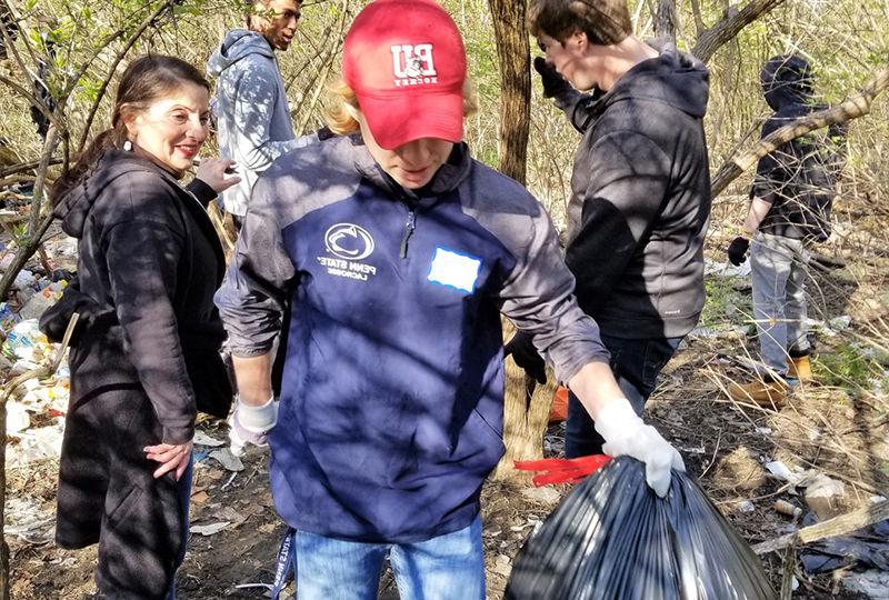 Students help cleanup park trails. Students help cleanup park trails.