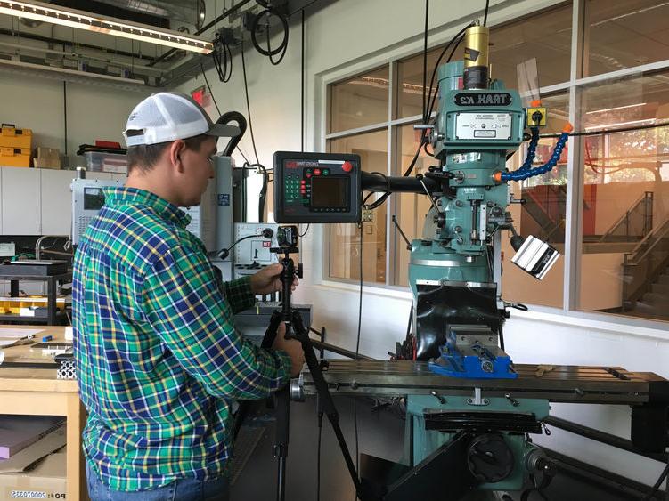 Wyatt Ritchie works on capturing machine shop equipment