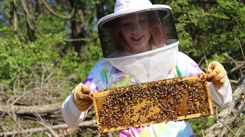 student with beehive