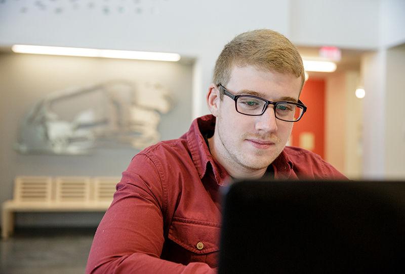 Berks student focusing on his studies in the library. Berks student focusing on his studies in the library.